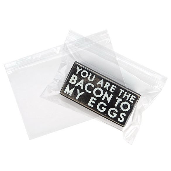 Grip Seal Bags with Hang hole 23x15cm Crystal Clear PP 50 micron, showing the bag while being filled and empty